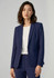 A woman wearing a navy blue blazer, styled with a white top, featuring a logo on the garment.