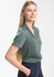A women's short sleeve button-up shirt in a soft green colour, featuring a collar and a relaxed fit.