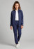 A girl models navy track pants with a matching jacket. The outfit features white stripes and a logo.