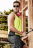 A man wearing a bright yellow hi-vis singlet and sunglasses, holding a hammer, with a construction backdrop.