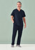 A man is wearing navy unisex scrub pants paired with a matching scrub top, standing against a light green background.