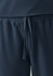 Navy women's jogger scrub pants with an elastic waistband and drawstring detail. Features smooth fabric and a logo.