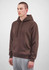 A brown hoodie with a front pocket and drawstring hood, modelled by a man wearing grey sweatpants.