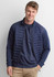 A men's tailor jacket in navy blue, featuring a quilted design and zip-up front, displayed on a smiling model.