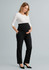 A pair of black maternity pants with a comfortable waistband, modelled by a woman wearing a white top.