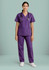 A model wearing purple Classic Women's Bootleg Scrub Pant paired with a matching top, complete with a stethoscope.