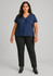 A model wearing a navy top and black mid-rise pull-on pants, with sleek black boots. The outfit features a subtle logo.