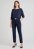Navy mid-rise pull-on pants paired with a matching top, featuring a sleek fit and a subtle logo.
