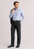 A man wearing stylish black slacks with a light blue shirt and a blazer, showcasing an adjustable waist design.