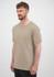 A short sleeve tee in a beige colour, featuring a logo, displayed on a male model against a neutral background.