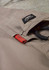 Rugged cooling stretch cargo pants in beige with a logo patch and tool loops.