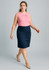 A woman in a pink top and navy lined skirt walks confidently, showcasing the relaxed fit of the skirt.
