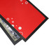 A red bar runner counter mat with a black edge featuring circular designs and a textured surface.