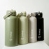 A drink bottle collection featuring four 1L bottles in olive green, cream, light grey, and black, each with a logo.