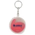 A clear container with a keyring holds a red reusable silicone straw inside. The container features a logo.