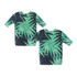 A drink bottle cooler designed as a cricket jersey with a green tropical leaf pattern. It features a logo.