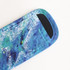 An Icy Pole Holder in vibrant blue and green patterns, featuring a soft fabric surface and a black opening.