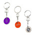 Three enamel trolley coin keyrings in purple, orange, and silver, each attached to a metal keyring.