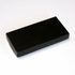 A sleek black box, rectangular in shape, with a smooth finish, suitable for packaging items.
