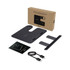 A wireless charger in black with a sleek design, accompanied by a manual, stand, and USB cable, packaged in a brown box.