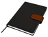 A black Cordoba A5 notebook with a brown closure strap and a ribbon bookmark. It features a logo.