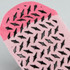 A pair of pink Nero ankle grip socks with black rubber grips on the underside.