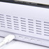 A white digital power clock with buttons and a charging port, featuring a sleek design and a logo.