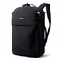 A black backpack with multiple compartments and padded shoulder straps, featuring a logo on the front.