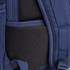 A navy backpack featuring mesh padding and adjustable straps. Includes a small pocket for additional storage.