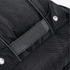 A close-up of a black Eiger backpack featuring textured fabric and a rectangular panel. It has a logo.