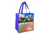 A purple tote bag featuring a full-colour beach scene with palm trees and a wooden walkway. It includes a logo.
