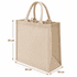 A large jute shopping bag in natural beige colour, featuring two rope handles and rectangular shape.