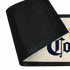 A black rubber bar mat with a textured underside and a colourful design on the top surface.