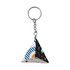A triangular keyring featuring a mix of geometric patterns in blue, black, green, and white.