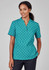 A teal tunic featuring a circular daisy print, designed with short sleeves and a relaxed fit. Includes a logo.