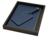 A blue travel journal set with a matching luggage tag, presented in a sleek black box.