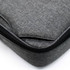 A grey laptop bag featuring a textured fabric and a zip closure. It includes a branding logo.