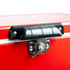 A red metal ice cooler box with a black handle and lock mechanism on the top.