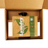 A brown box containing laundry detergent sheets and a black spout, with eco-friendly branding visible.