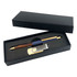 A gift set featuring a gold-accented pen and a silver USB drive in a black presentation box.