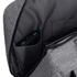 A grey slate backpack featuring an inner pocket with a device and USB ports visible.
