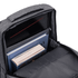 A grey backpack’s interior displays books and a laptop compartment, featuring a sleek design and ample storage space.