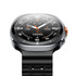 A smart watch featuring a black strap, round face, and multiple fitness tracking icons. It has a branded logo.