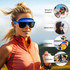 A pair of blue flip-up visor sunglasses on a model outdoors, with a logo visible on the product.