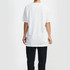 A white t-shirt with short sleeves is displayed on a person from the back, paired with black trousers. The shirt features a logo.
