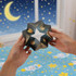 A hands-on 3D Flips Puzzle Disc in dark colours features an intricate star-like design against a starry background.