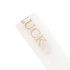 A soft white ribbon with gold text, featuring a logo or branding on the surface.