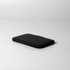 A black pocket mirror with a slim, rectangular design, featuring a soft-touch finish and minimalistic look.