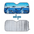 A foldable car sunshade featuring a colourful dolphin design on the front and a reflective silver surface on the back.