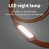 A 6-in-1 night light charging cable in orange, featuring an LED light integrated into the design.